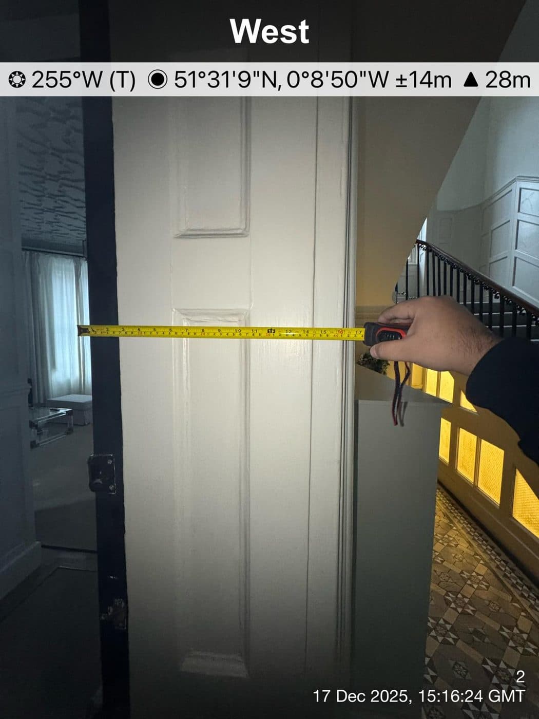 Fire door being measured and inspected during a fire risk assessment