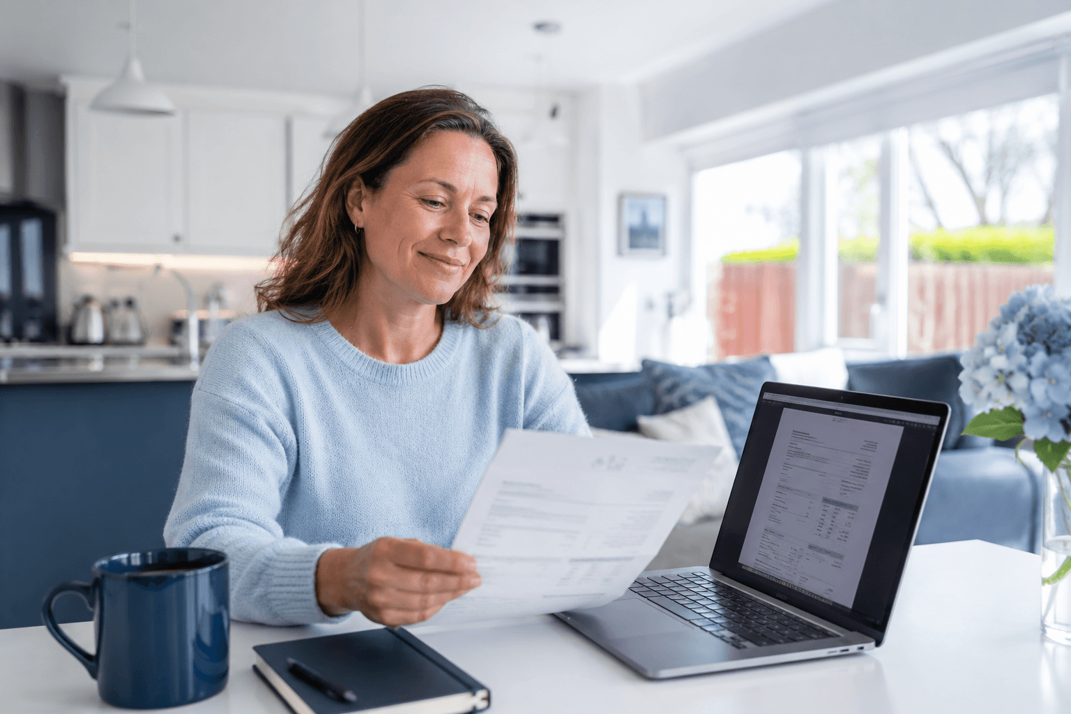 London landlord reviewing their emailed EICR certificate at home